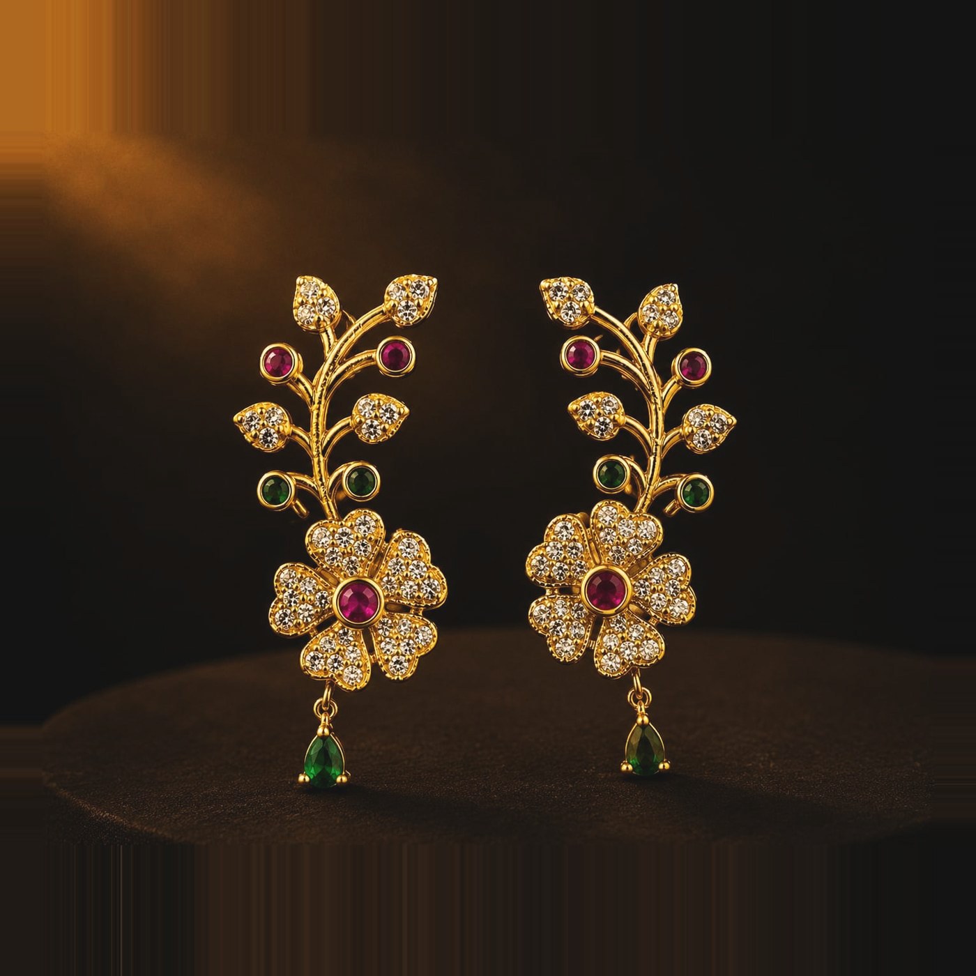 Clear stone vine earrings with emerald-toned pear drop
