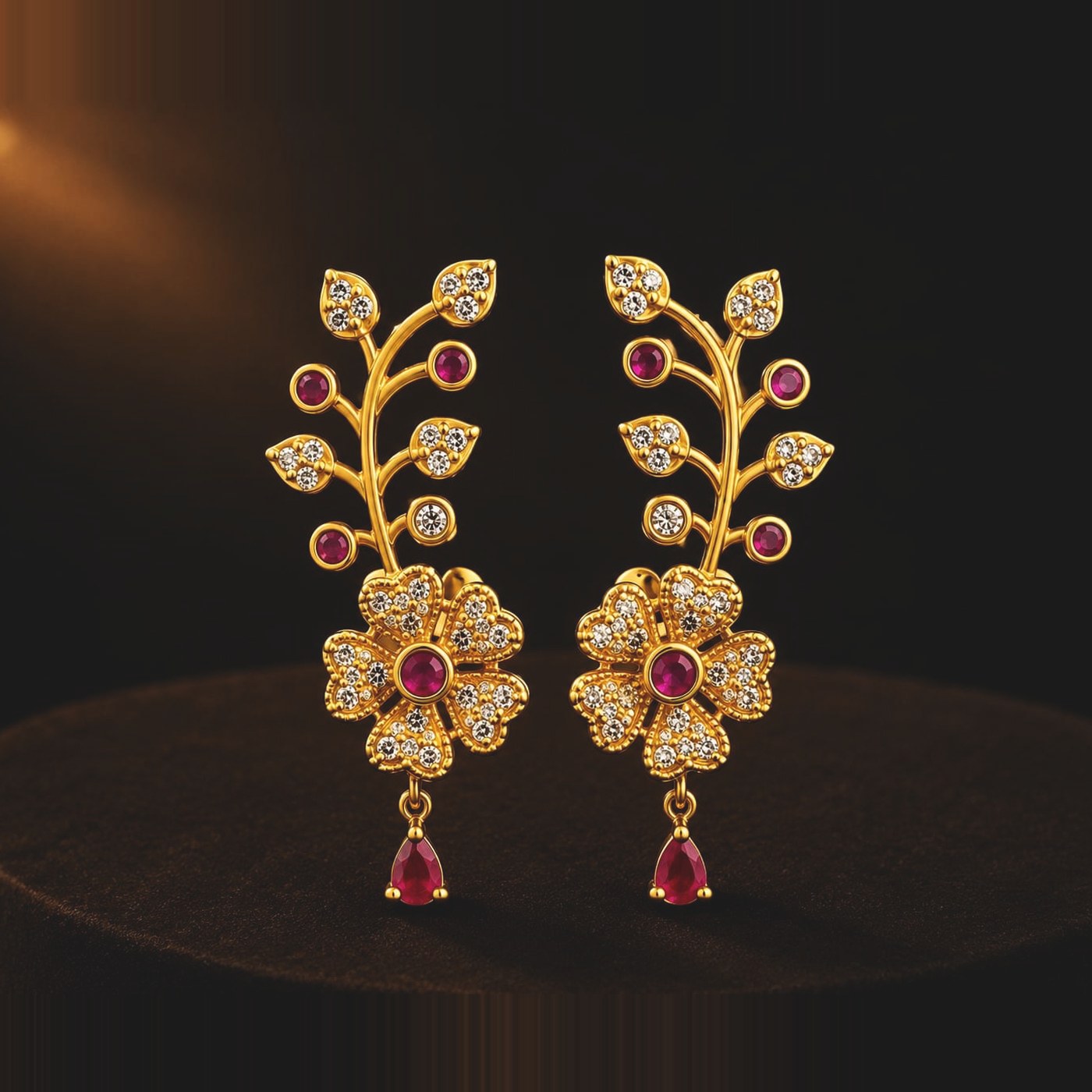 Clear stone vine earrings with ruby-toned pear drop