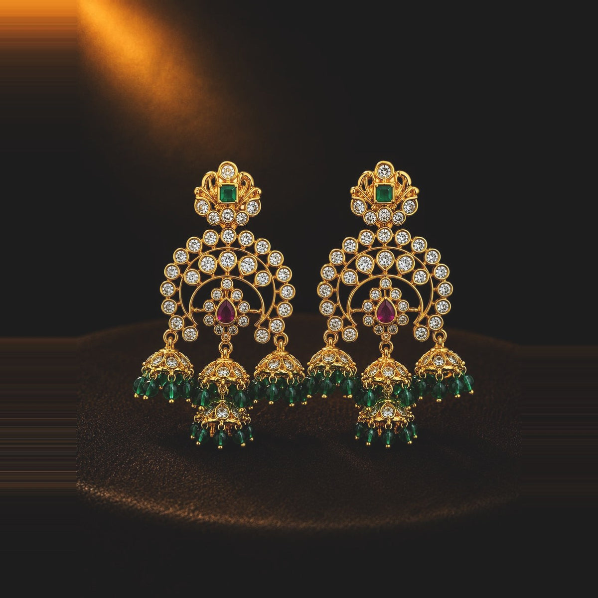 Emerald-toned jhumka chandbali earrings with bell drops